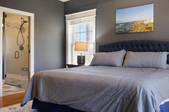 701 Chalupsky Ave SE, New Prague, MN 56071 - bedroom featuring wood finished floors and ensuite bathroom