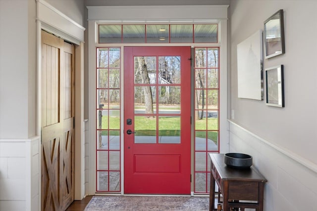 701 Chalupsky Ave SE, New Prague, MN 56071 - entryway featuring wainscoting and plenty of natural light