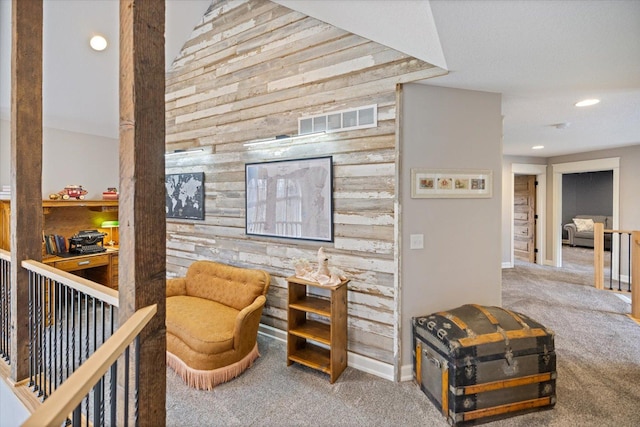 701 Chalupsky Ave SE, New Prague, MN 56071 - living area with carpet flooring, wood walls, recessed lighting, and baseboards