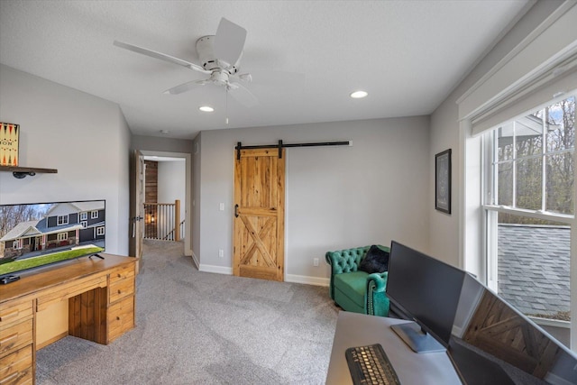 701 Chalupsky Ave SE, New Prague, MN 56071 - living area with a barn door, an office area, ceiling fan, carpet flooring, and baseboards