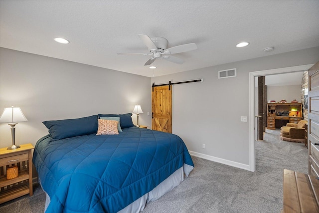 701 Chalupsky Ave SE, New Prague, MN 56071 - bedroom featuring light carpet, a barn door, recessed lighting, ceiling fan, and baseboards