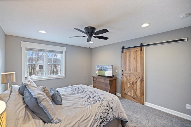 701 Chalupsky Ave SE, New Prague, MN 56071 - bedroom featuring carpet, a barn door, baseboards, recessed lighting, and a ceiling fan