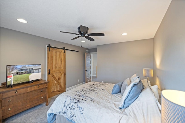 701 Chalupsky Ave SE, New Prague, MN 56071 - bedroom featuring a barn door, carpet, recessed lighting, and a ceiling fan