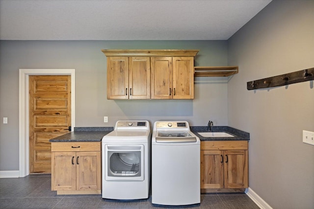 701 Chalupsky Ave SE, New Prague, MN 56071 - washroom with cabinet space, independent washer and dryer, baseboards, and dark tile patterned floors