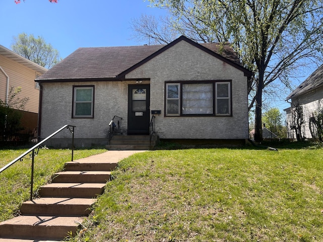 1008 4th St E, Saint Paul, MN 55106 - bungalow-style house with roof with shingles