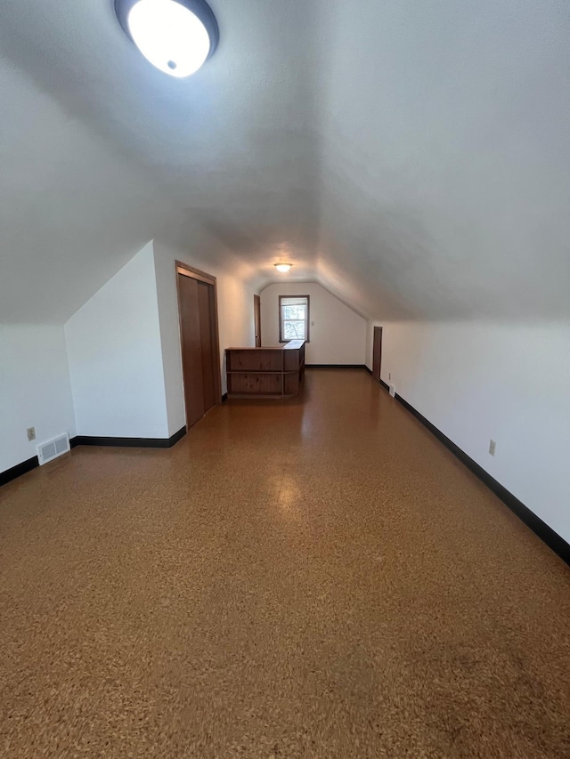 1008 4th St E, Saint Paul, MN 55106 - bonus room featuring baseboards and lofted ceiling