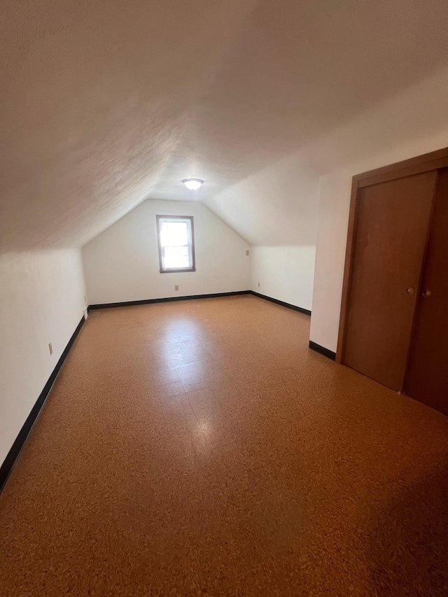 1008 4th St E, Saint Paul, MN 55106 - additional living space with baseboards and lofted ceiling