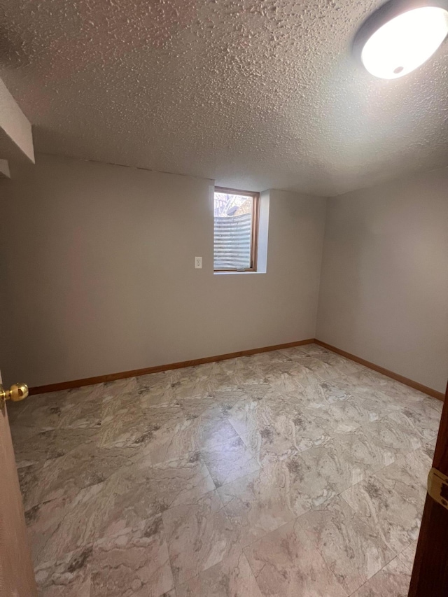 1008 4th St E, Saint Paul, MN 55106 - unfurnished room with a textured ceiling and baseboards