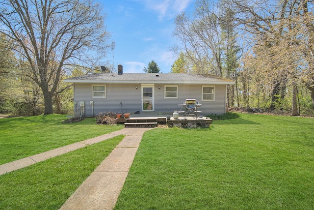 1418 345th Ave, Frederic, WI 54837 - view of front of property with a deck and a front lawn