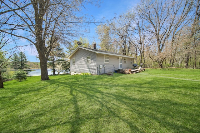 1418 345th Ave, Frederic, WI 54837 - rear view of property featuring a yard and a water view