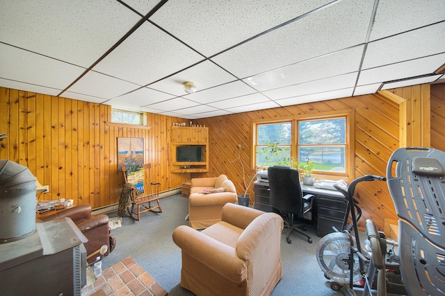 1418 345th Ave, Frederic, WI 54837 - living room with wooden walls, carpet floors, and a paneled ceiling