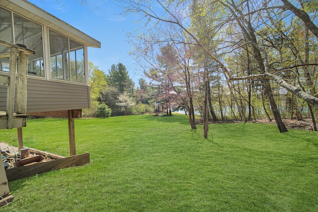 1418 345th Ave, Frederic, WI 54837 - view of green lawn featuring a sunroom