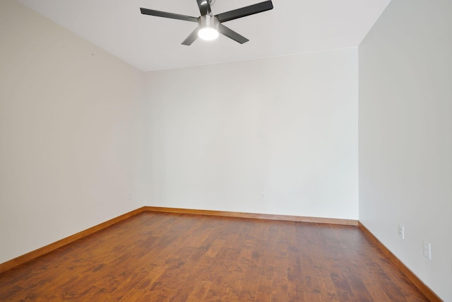 unfurnished room featuring a ceiling fan, baseboards, and wood finished floors