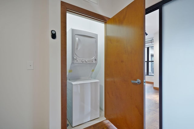 washroom with stacked washer / dryer