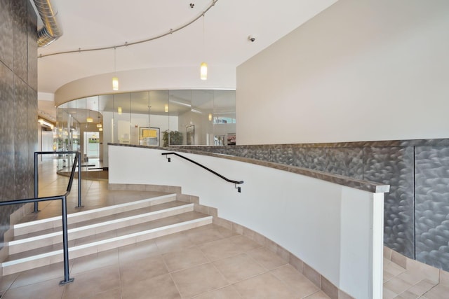 staircase featuring tile patterned floors