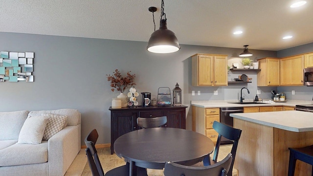 kitchen with a sink, light brown cabinets, open floor plan, light countertops, and open shelves