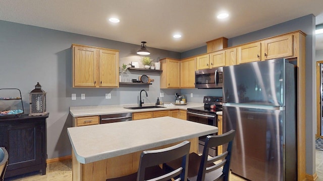 kitchen featuring appliances with stainless steel finishes, a sink, light brown cabinetry, open shelves, and light countertops