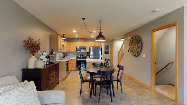dining area featuring stairs, recessed lighting, baseboards, and a textured ceiling