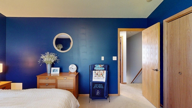 bedroom featuring carpet floors, a closet, and baseboards