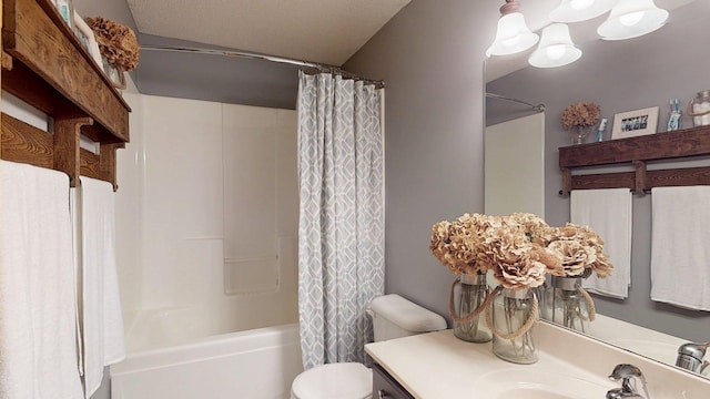 full bath with toilet, vanity, shower / bath combination with curtain, and a chandelier