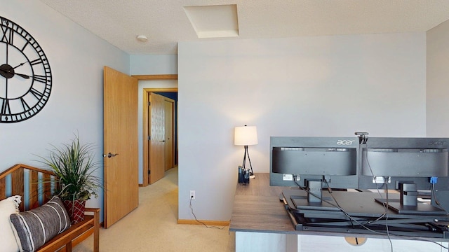 carpeted office space with baseboards