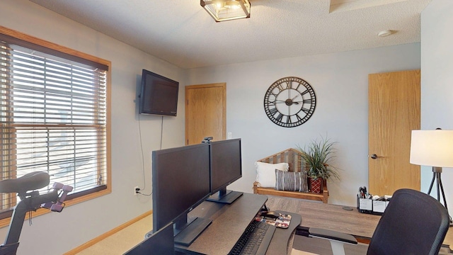 office with wood finished floors and a textured ceiling