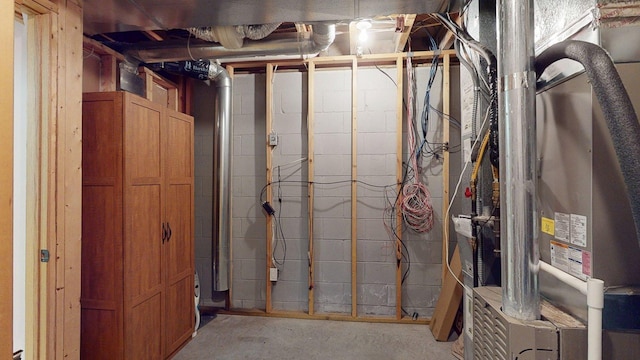 unfinished basement with concrete block wall