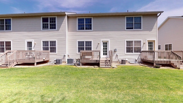 rear view of house with a deck and central air condition unit