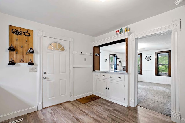 706 Broad St, Mankato, MN 56001 - foyer entrance featuring wood finished floors