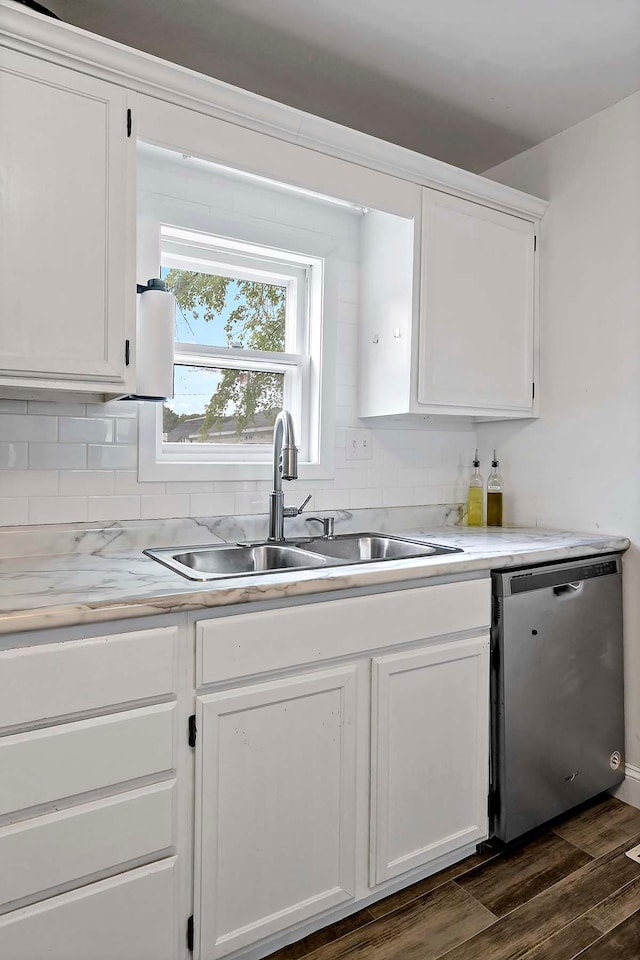706 Broad St, Mankato, MN 56001 - kitchen with dishwasher, a sink, white cabinetry, tasteful backsplash, and light countertops
