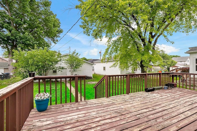 706 Broad St, Mankato, MN 56001 - wooden deck featuring a lawn
