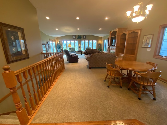 dining space featuring carpet floors, a chandelier, recessed lighting, lofted ceiling, and baseboards