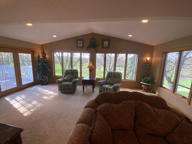 carpeted living room featuring vaulted ceiling and recessed lighting