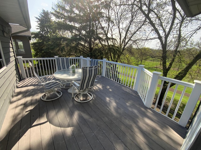 wooden terrace featuring outdoor dining area