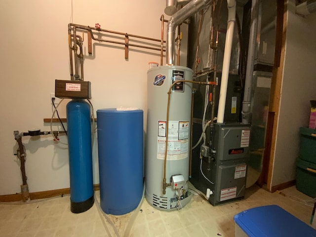 utility room featuring water heater