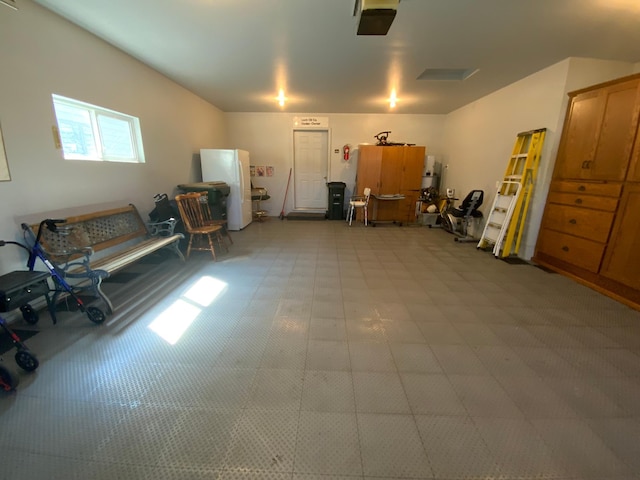 garage with freestanding refrigerator