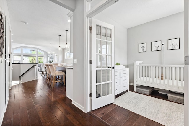 8172 Virginia Ln, Savage, MN 55378 - bedroom with dark wood-style flooring, a chandelier, baseboards, and lofted ceiling