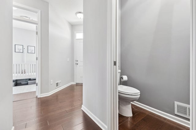 8172 Virginia Ln, Savage, MN 55378 - bathroom featuring toilet, wood finished floors, and baseboards