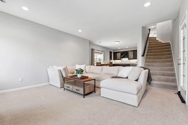8172 Virginia Ln, Savage, MN 55378 - living area with light colored carpet, stairs, recessed lighting, and baseboards