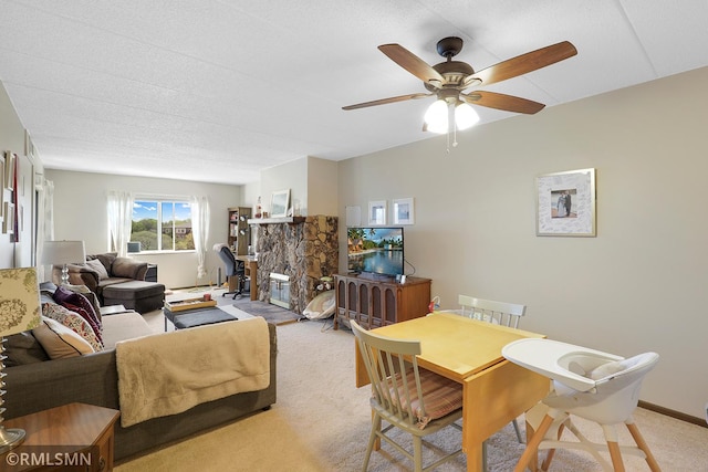 3300 Louisiana Ave S Unit 517, Saint Louis Park, MN 55426 - living room featuring light carpet, a ceiling fan, and a fireplace