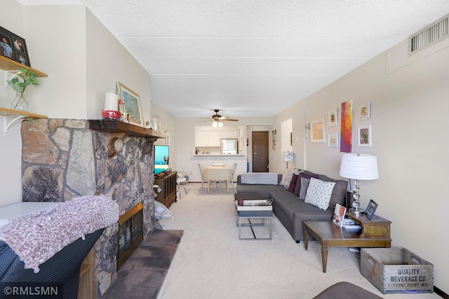 3300 Louisiana Ave S Unit 517, Saint Louis Park, MN 55426 - living area with light colored carpet, a ceiling fan, and a fireplace