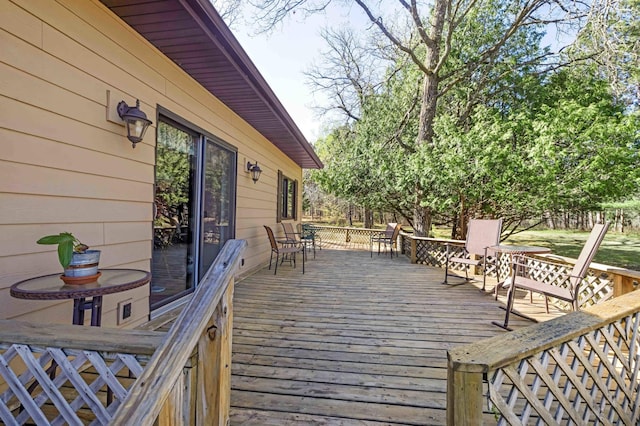 wooden deck with outdoor dining area
