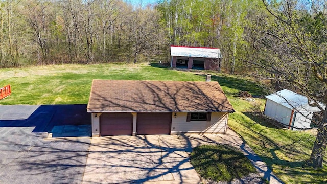 garage featuring a forest view