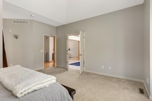 bedroom featuring light colored carpet and baseboards