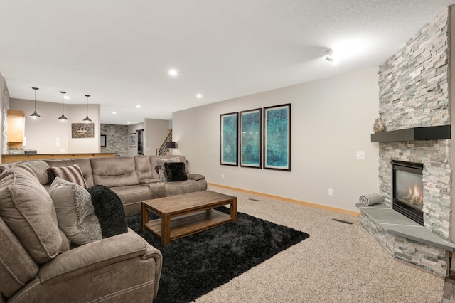 living room with a fireplace, carpet floors, baseboards, stairway, and recessed lighting