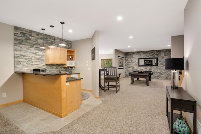 kitchen with dark countertops, white microwave, light brown cabinetry, recessed lighting, and light tile patterned flooring