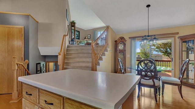 2647 Olive Ln, Sauk Rapids, MN 56379 - kitchen featuring light wood-style flooring, a chandelier, pendant lighting, and light countertops