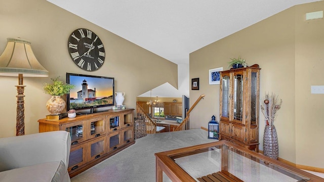 2647 Olive Ln, Sauk Rapids, MN 56379 - living area featuring lofted ceiling, a chandelier, carpet, and baseboards