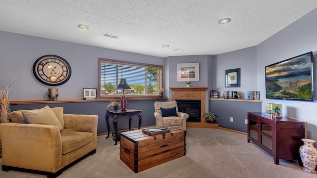 2647 Olive Ln, Sauk Rapids, MN 56379 - carpeted living area featuring a textured ceiling, a glass covered fireplace, baseboards, and recessed lighting