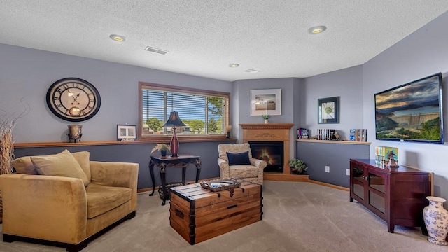 2647 Olive Ln, Sauk Rapids, MN 56379 - living room featuring a textured ceiling, carpet floors, a glass covered fireplace, baseboards, and recessed lighting